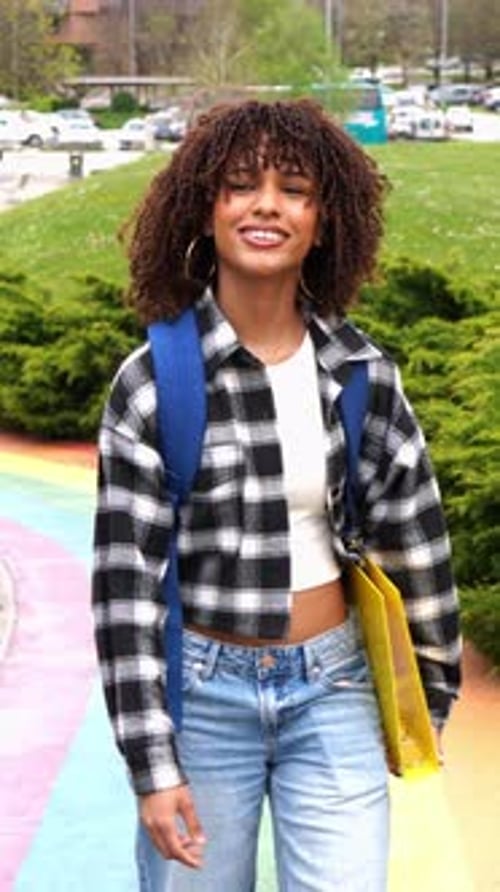 Young Latina Student Walking on Campus in Slow Motion