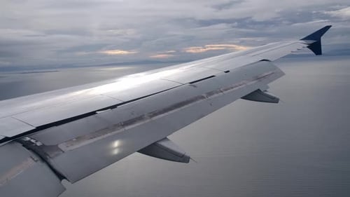 Fully Extended Flaps Airplane Wing in Landing Configuration in Flight