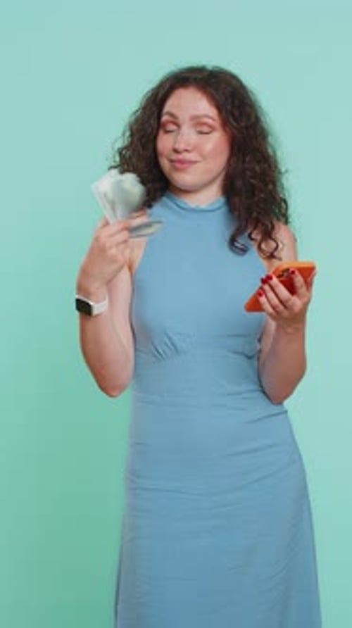 Woman with Money and Smartphone in Portrait Orientation