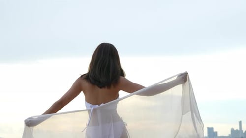 Smiling Young asian woman bikini sexy with shawl on a seaside beach tropical resting