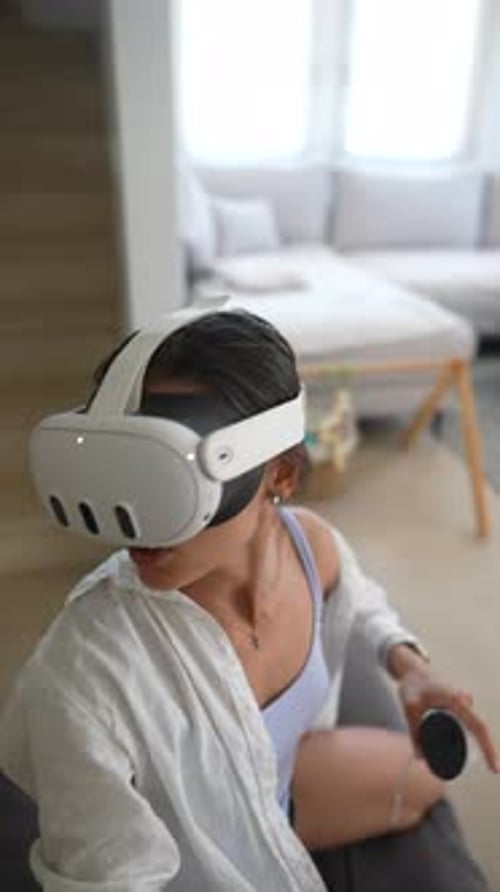 Young Woman Using VR Headset at Home