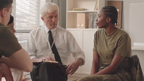 Professor at Military College Having Conversation with Cadets