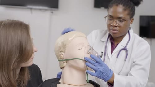 First aid training session at the clinic with hands-on practice on a CPR mannequin