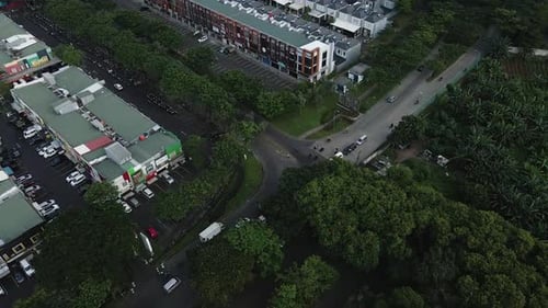 Aerial View Of Vehicles Passing On Streets In Suburban Area Of Jakarta, Indonesia - drone shot