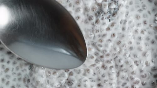Dessert Made From Soaked Chia Seeds. I Spread Them With A Spoon. Top View, Close-Up.