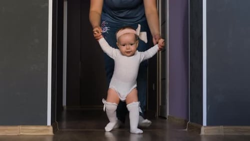 Baby's First Steps with Parental Support Indoors