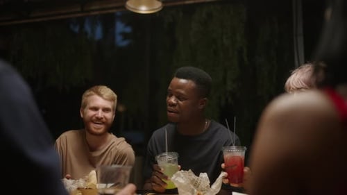 Friends Gathering to Celebrate at Night