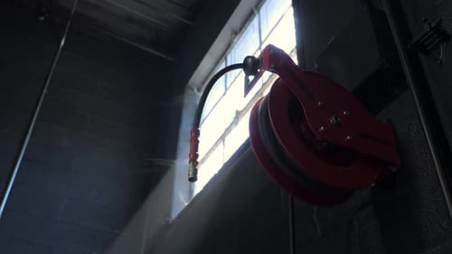 Window in a Building with Sun Rays and Dust Flying in the Air Move Camera Shot