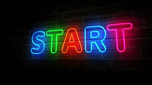 Colorful Neon START Sign Animation on Brick Wall