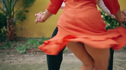 Unknown Young Street Dancers Moving Seductively in Town Park. View Energetic Woman