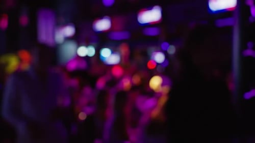 Nightclub Scene with Vibrant Lights in Soft Focus