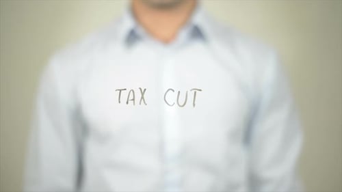 Tax Cut, Man Writing on Transparent Screen