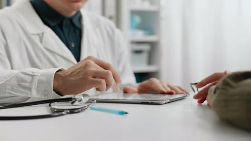 Doctor Using Tablet Then Shaking Patient's Hand
