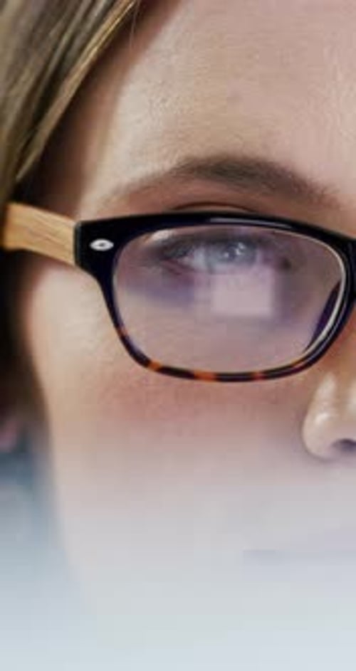 Glasses, laptop screen and businesswoman in office reading for finance report with budget plan
