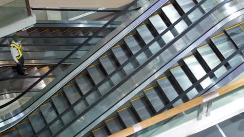 POV to the escalator in department store/international airport without people