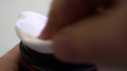 preparing and cleaning camera equipment, cleaning lens with a lens cloth, 4K