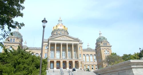 Walking up the steps at des moines Iowa state capitol on a sunny day