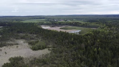 Flying over interesting marsh landscape on an overcast day