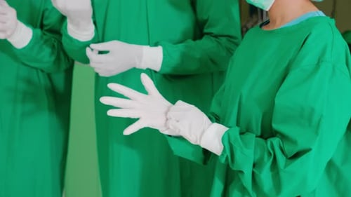 Surgeons Preparing, Putting on Sterile Surgical Gloves