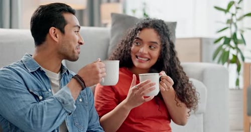 Smiling Couple Drinking Beverages at Home