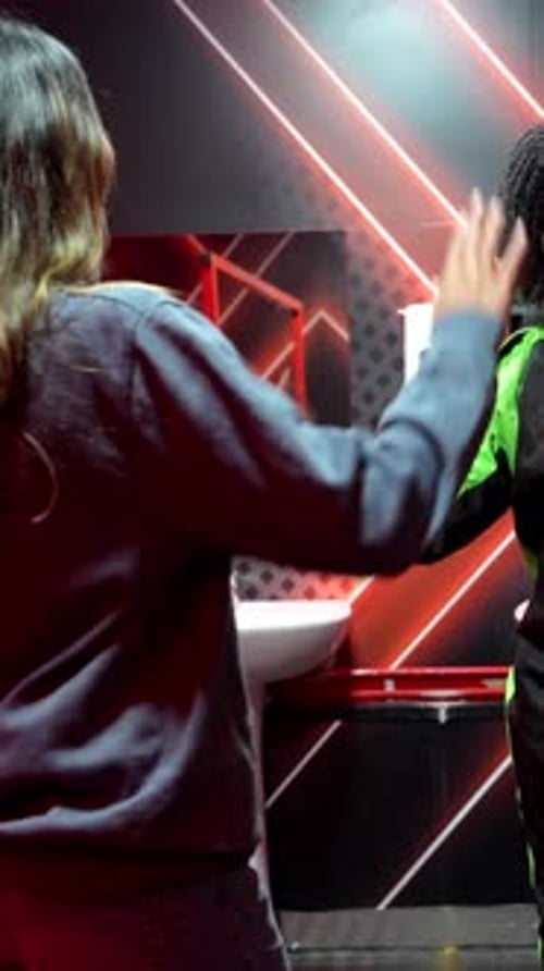 Excited Friends High Fiving and Celebrating Go Kart Victory