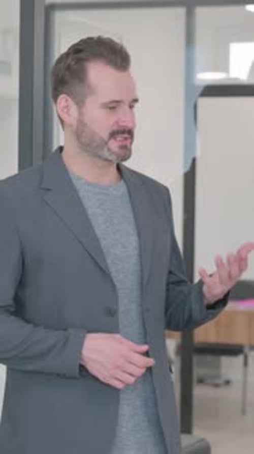 Mixed Race People Discussing Work while Standing in Office, vertical video