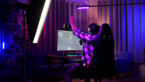 Asian Boy Streamer Celebrating Winning Game On Computer. Live Stream Video Game