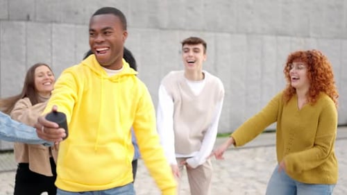 Multiethnic Happy Friends Dancing Excited in the City