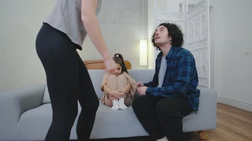 Parents Console Sad Child During Difficult Conversation