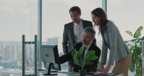 Collaborative Team of Businessmen and Office Manager Woman Using Compiuter Browsing Project Solving