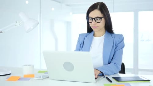 Female Designer Working on New Plan in Office