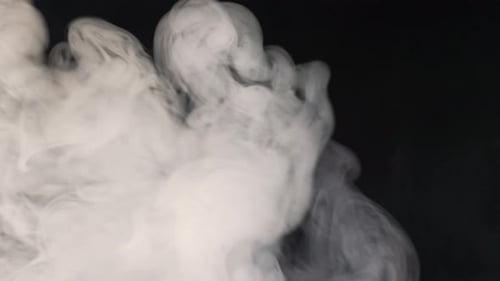 Translucent White Smoke Against Black Background