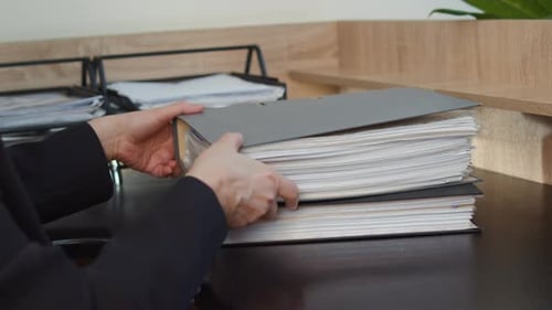 Stack of Paper Documents on Office Desk