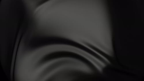 Schwarzer Satinstoff, der sanft im Wind weht, nahtloser, umlaufender Hintergrund