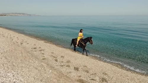 Riding a Horse on the Beach