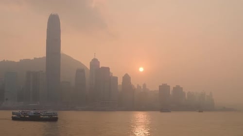 Hong Kong island at sunset. View taken from Kowloon waterfront