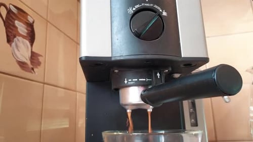 Espresso Machine Brewing Coffee in Kitchen Close Up