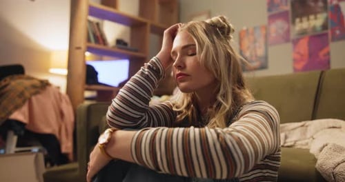 Woman, sad and stress in bedroom with depression for unemployment, failure
