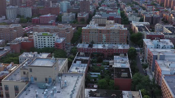 Aerial footage over the Harlem Neighborhood of NYC. Urban rooftops at ...