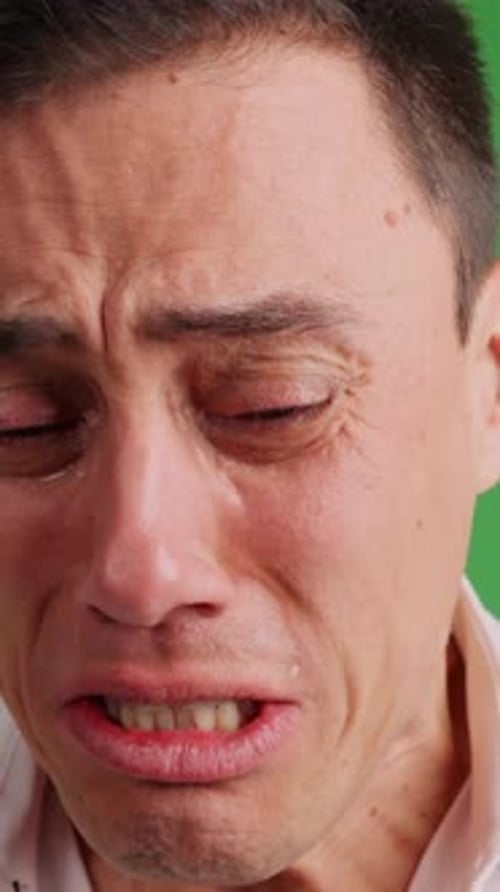 Sad Man Crying Desperately on Green Screen Background