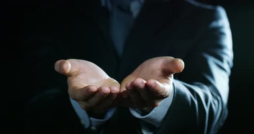 Offering Hands of a Man in Suit