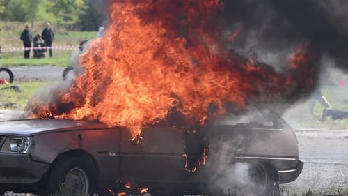 Car on Fire in Controlled Outdoor Environment