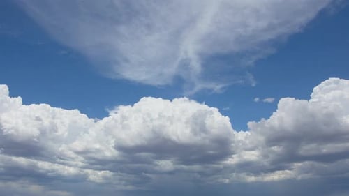 Timelapse of White Clouds Moving Across Blue Sky