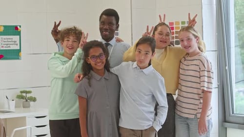 Portrait of Cheerful Classmates and Teacher at School