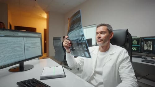 Doctor Examining X-Ray in Modern Hospital Office