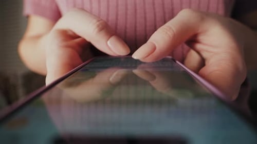 Woman's Fingers Tap on Mobile Phone Indoors