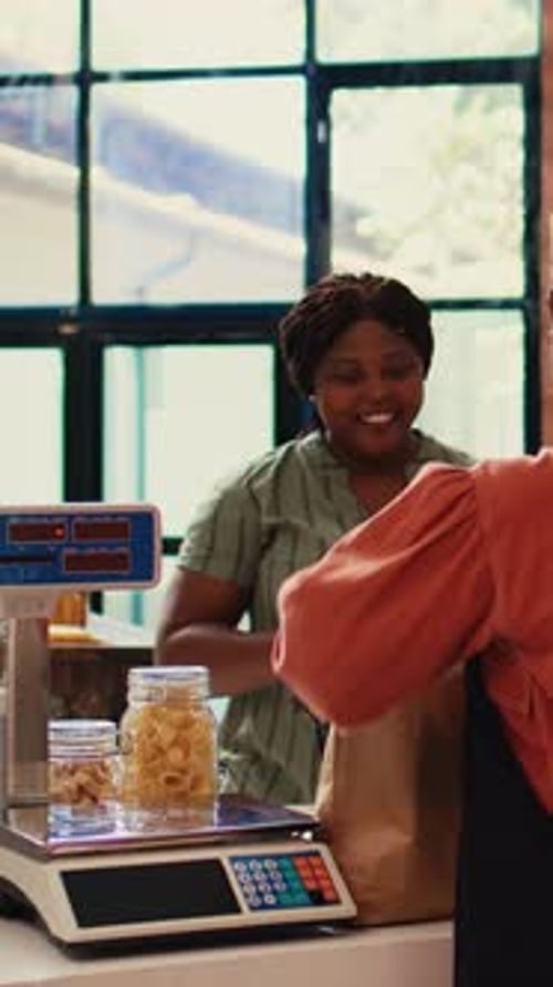 Women at Market Filling Jars With Food