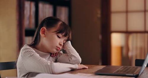 Child, tired and laptop in home for learning, exhausted and bored with homework