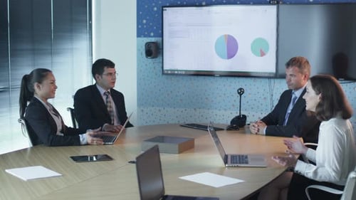 Team Of Office Workers Have Conversation in Conference Room.