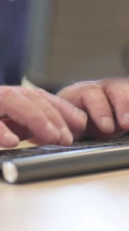 Side View of Senior Old Businessman Typing on Keyboard at Work, vertical video
